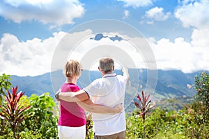 Senior couple hiking in mountains and jungle