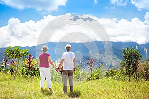 Senior couple hiking in mountains and jungle