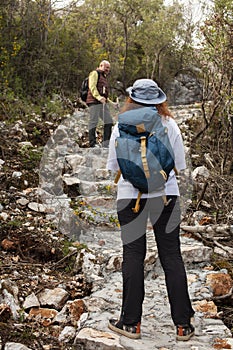 senior couple hiking outdoor, man and woman norwegian walking with sticks