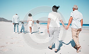 Senior couple, holding hands and family at beach with back for walk, freedom and vacation together with love. Old man