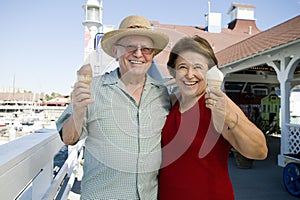 Senior Couple Holding Ice-Creams