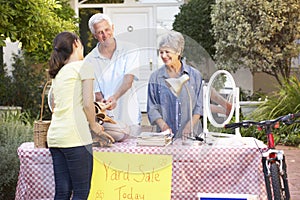 Senior Couple Holding Yard Sale