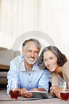 Senior couple, home and portrait with tablet, smile and bonding together with internet and social media. Apartment, old