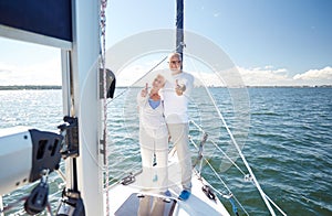 Senior couple hugging on sail boat or yacht in sea