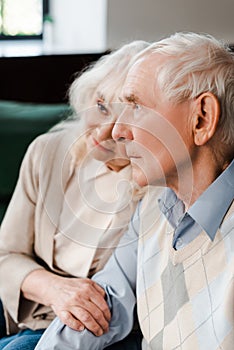 Senior couple hugging and sitting at