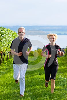 Senior couple jogging for sport