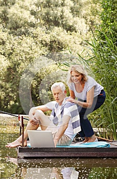 Senior couple with laptop