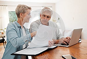 Senior couple, laptop and home finance while reading paperwork documents and typing on computer for retirement savings