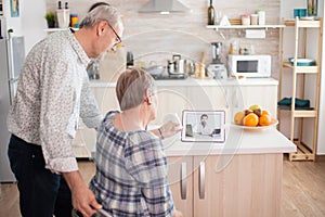 Senior couple listening doctor