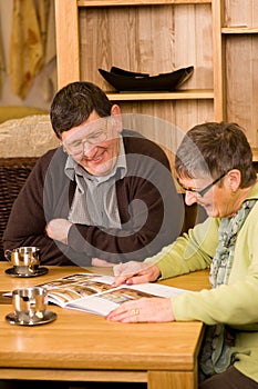 Senior couple looking at brochure