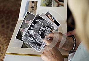 Senior couple looking at family photo album photo
