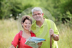 Senior couple looking at map