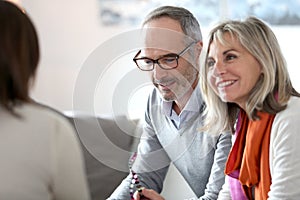 Senior couple meeting banker photo