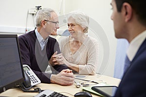 Senior Couple Meeting With Consultant In Hospital