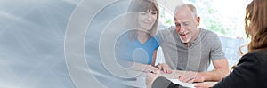 Senior couple meeting financial adviser. panoramic banner