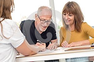 Senior couple meeting real estate agent