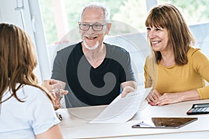 Senior couple meeting real estate agent
