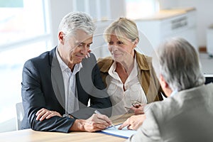Senior couple meeting real-estate agent