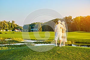 Senior couple, nature and sky.