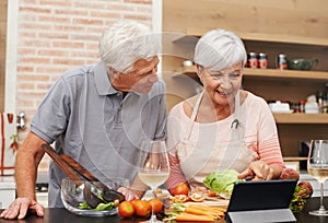 Senior, couple and online, cooking and tablet for learning, videos and guide for diet and internet. House, old man and