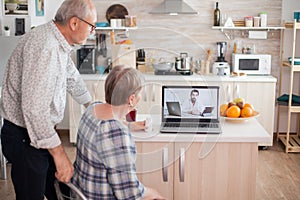 Senior couple during online medical check up