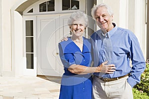 Senior couple outside house