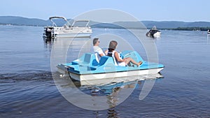 Senior couple on pedalo also called pedal boat on a lake