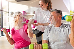 Senior couple with a personal trainer