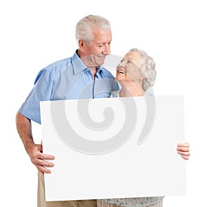 Senior couple with placard