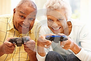 Senior couple playing computer games