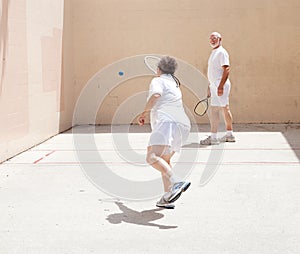 Senior Couple Playing Racquetball photo