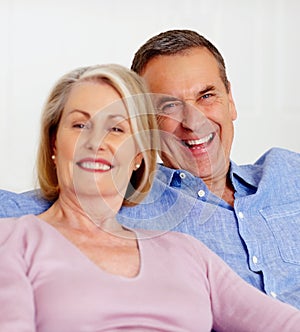 Senior, couple and portrait or happy on sofa with support, relationship and marriage in retirement home. Elderly, man