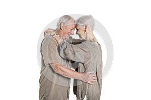 Senior couple posing on studio white background