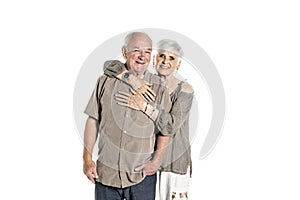 Senior couple posing on studio white background