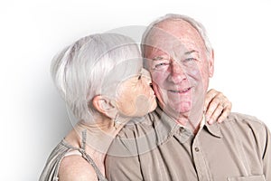 Senior couple posing on studio white background