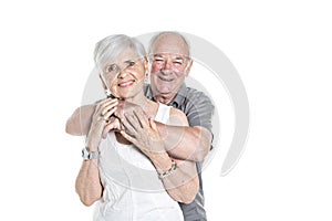 Senior couple posing on studio white background