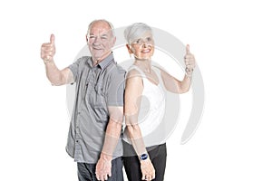 Senior couple posing on studio white background