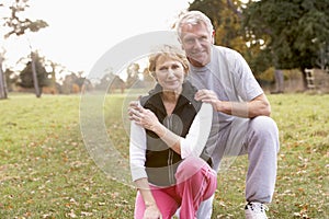 Senior Couple Power Jogging In The Park