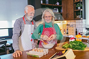 Senior couple preparing food in the kitchen