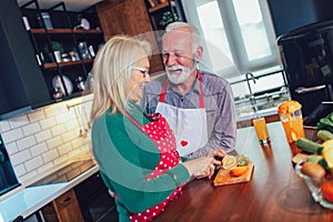 Senior couple preparing food in the kitchen