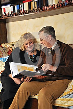 Senior couple reading a book