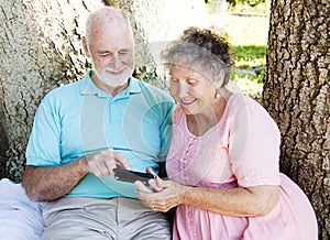 Senior Couple Reads Text Message