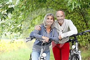 Senior couple ready for riding bicycle