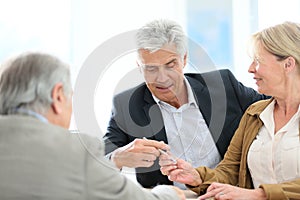 Senior couple with real-estate agent