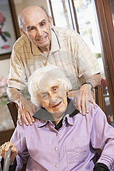 Senior couple relaxing in armchairs