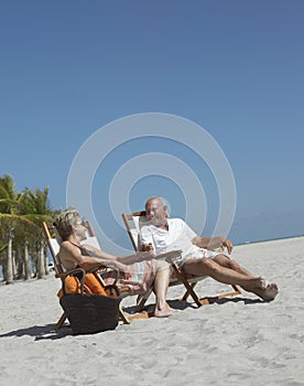 Senior Couple Relaxing On Beach