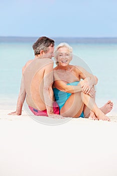 Senior Couple Relaxing On Beautiful Beach Together