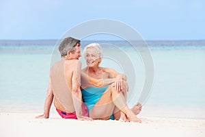 Senior Couple Relaxing On Beautiful Beach Together