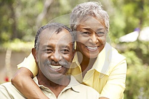 Senior Couple Relaxing In Garden