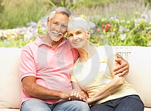 Senior Couple Relaxing In Garden